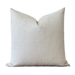 a white striped pillow on a black background