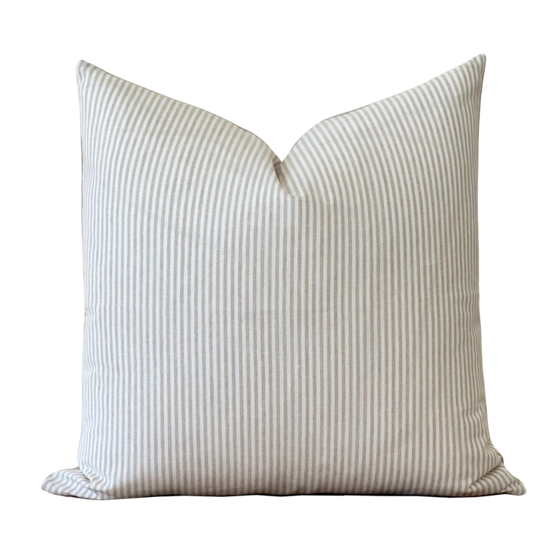 a white striped pillow on a black background