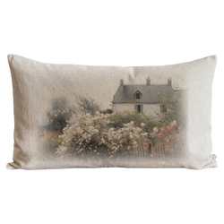 a white pillow with a picture of a house on it