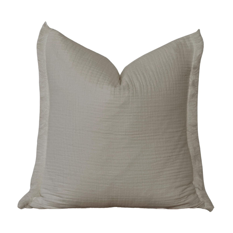 A plain, white, square pillow with a simple, minimalist design.