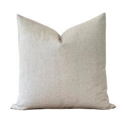 a white pillow on a black background