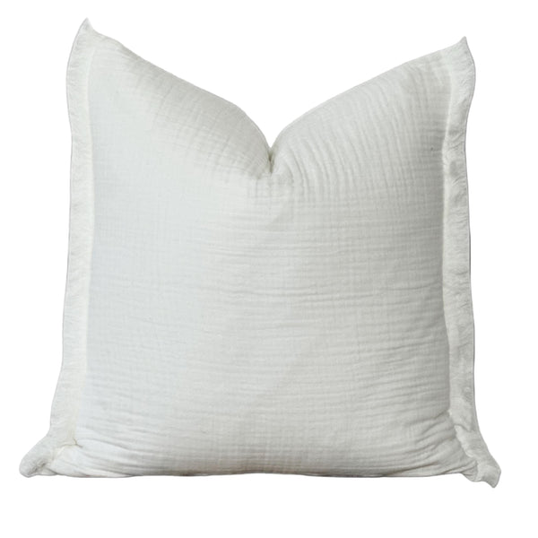 A white, fluffy pillow with a textured surface.