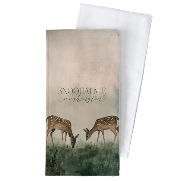 two deer grazing in a field, with the text "SNOQUALMIE WASHINGTON" displayed prominently on the cover.