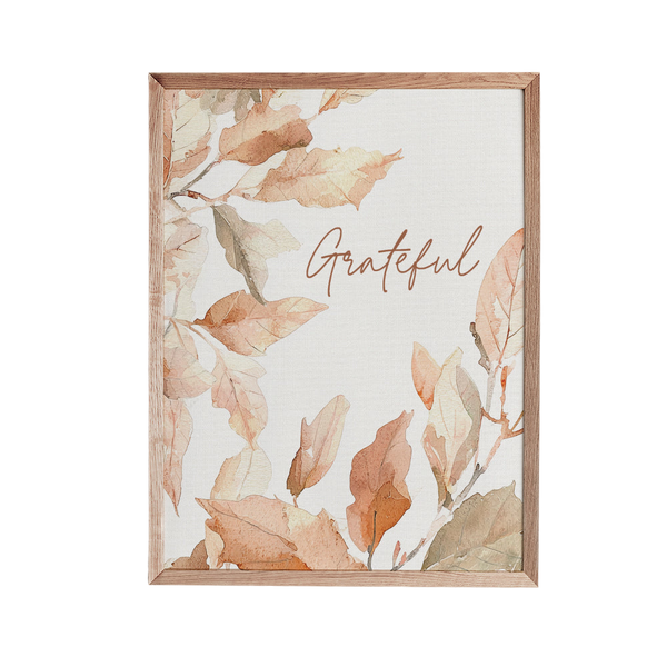 a picture frame with a picture of leaves on it