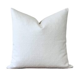 a white pillow on a black background