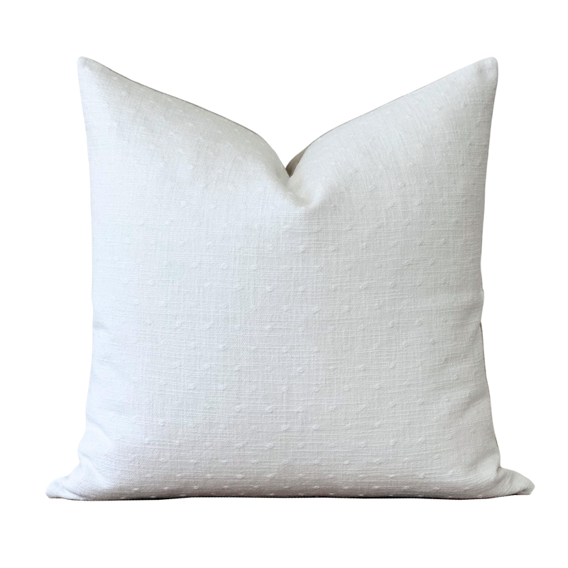 a white pillow on a black background