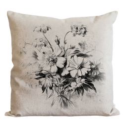 a black and white picture of flowers on a pillow