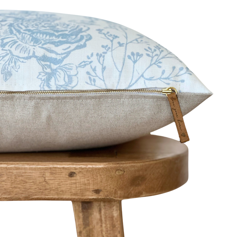 a pillow sitting on top of a wooden chair