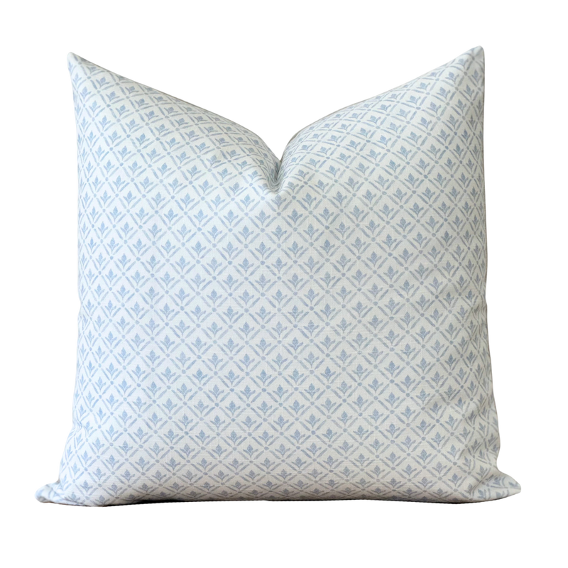 a white and blue pillow on a black background