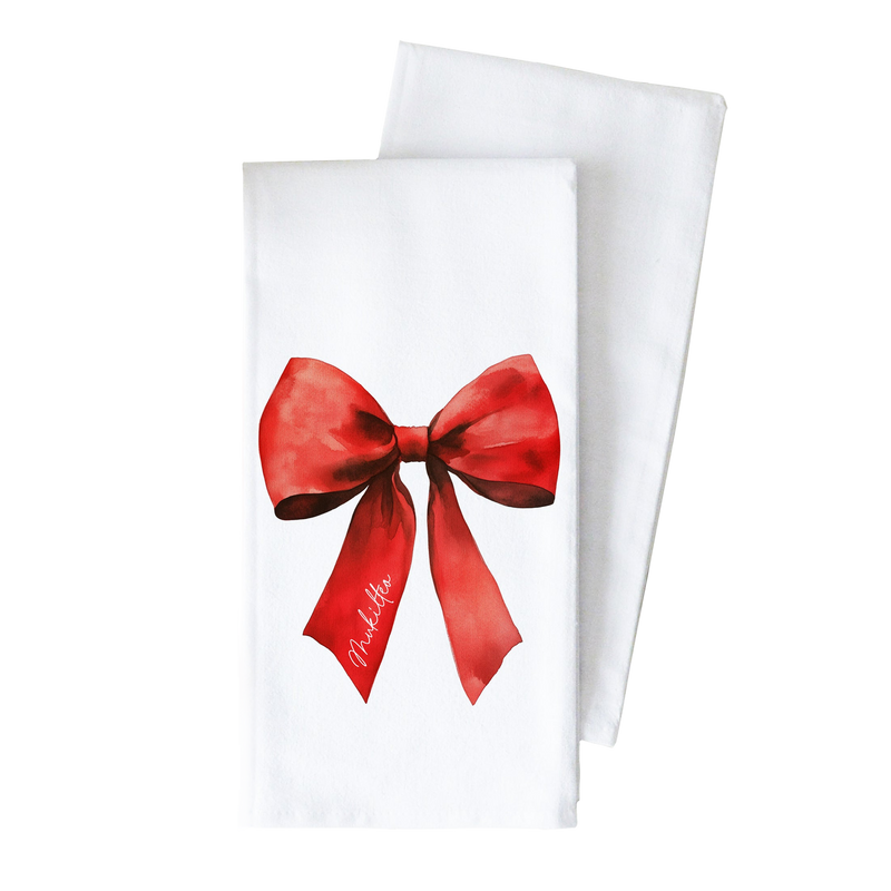 a white towel with a red bow on it.