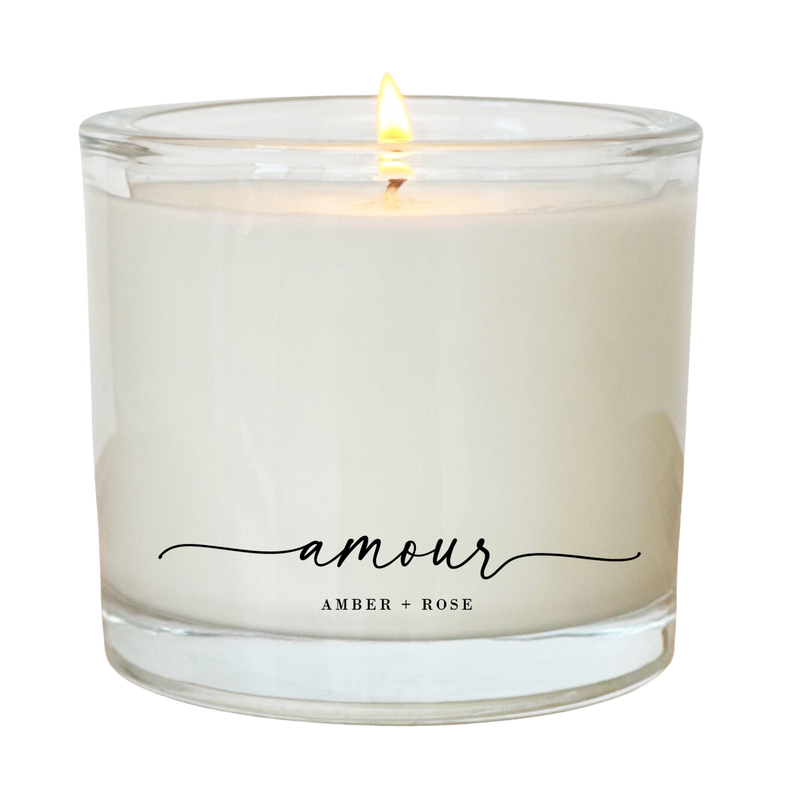 a white candle with an inscription on it