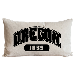 a black and white pillow with the word oregon on it