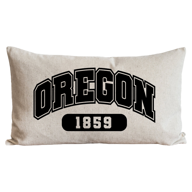 a black and white pillow with the word oregon on it