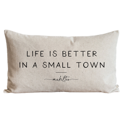 a pillow that says life is better in a small town