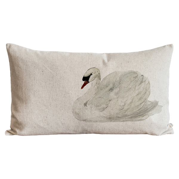 a white pillow with a picture of a swan on it