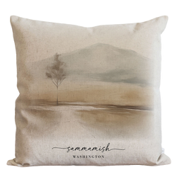 a pillow with a picture of a tree on it