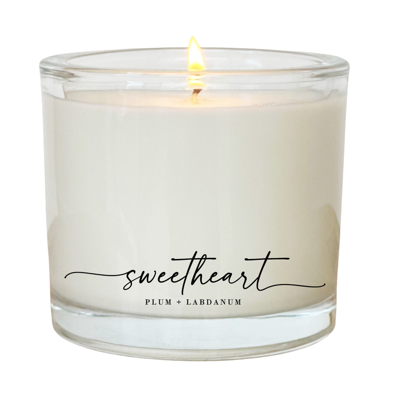 a white candle with the word sweet heart written on it