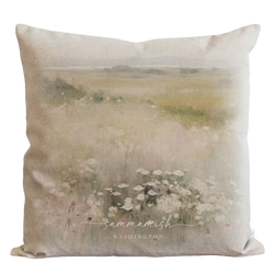 a pillow with a painting of flowers on it