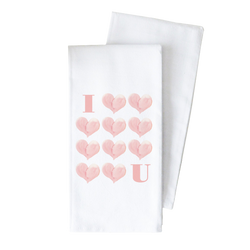 two towels with hearts on them on a black background